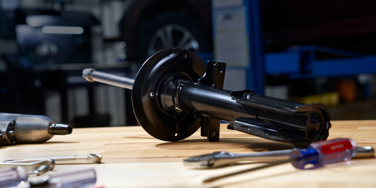 A Mechanic Is Replacing the Engine Filter of a Vehicle