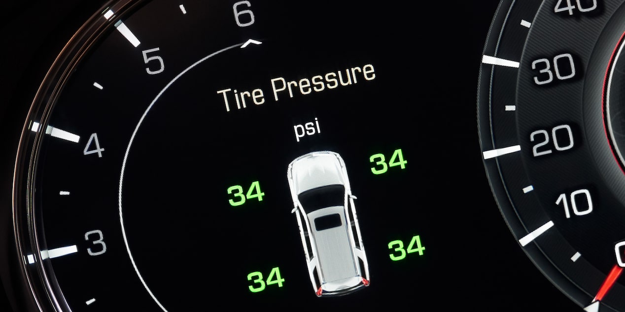 A Mechanic Is Seen Inspecting a Windshield Wiper