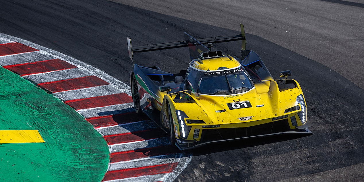 The Yellow V-Series.R Racecar Driving Down a Track