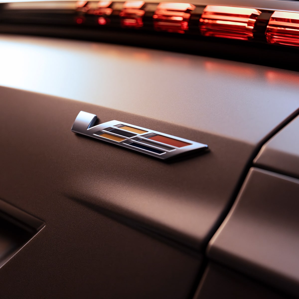 Close-up of the V-Series Logo on a Cadillac Trunk