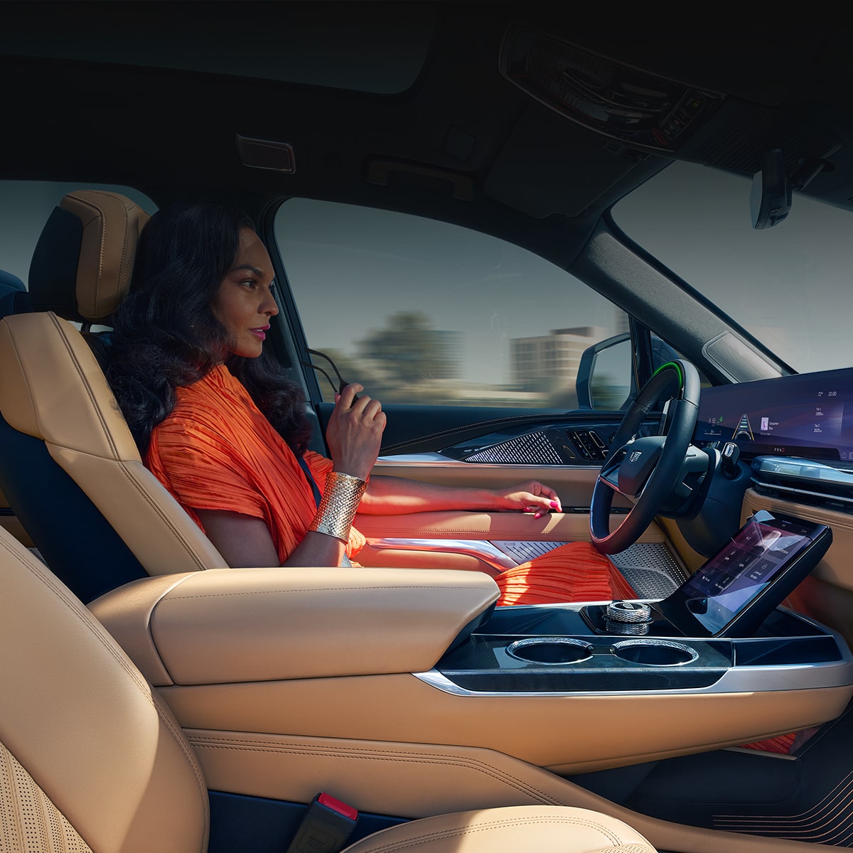 Passenger View of a Woman Driving a Cadillac with Hands off Steering Wheel and Utilizing the Super Cruise Feature