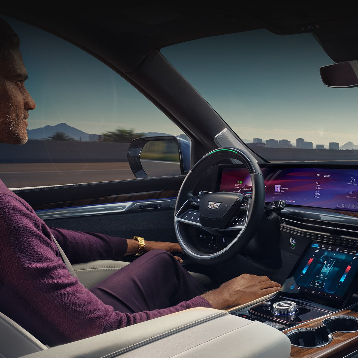 Passenger View of a Man Driving the 2025 Cadillac Escalade While Utilizing the Super Cruise Feature