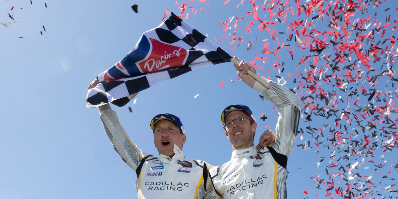 Two Cadillac Racing Drivers Celebrate a Win as Confetti Falls