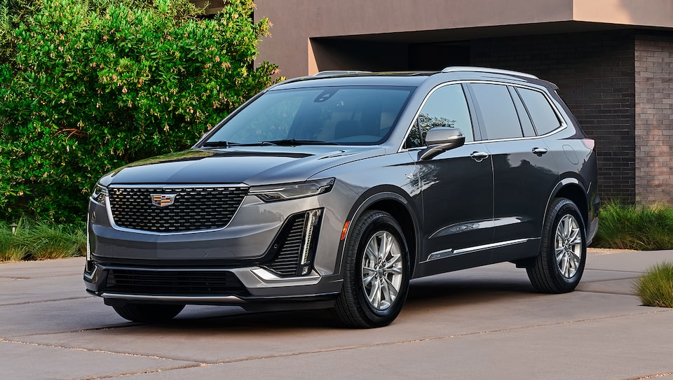 Cadillac Escalade Parked in Front of Family Home in Driveway