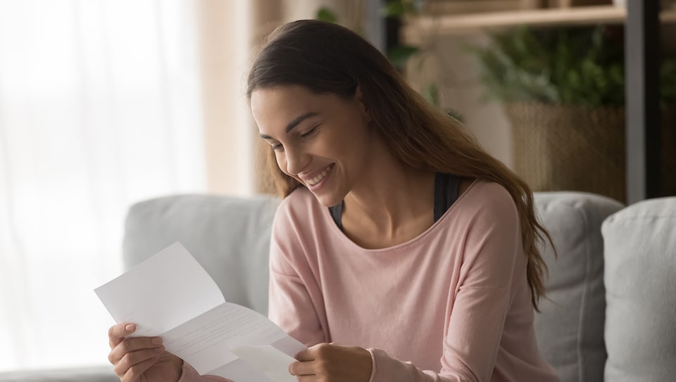 Woman Viewing Her My Cadillac Rewards Extended Family Card Statement 