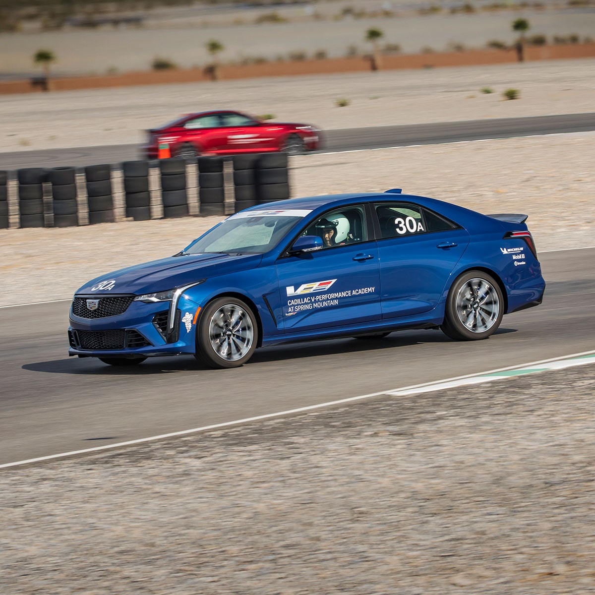 A Cadillac-V Performance Racing Academy Vehicle Practicing on the Race Track