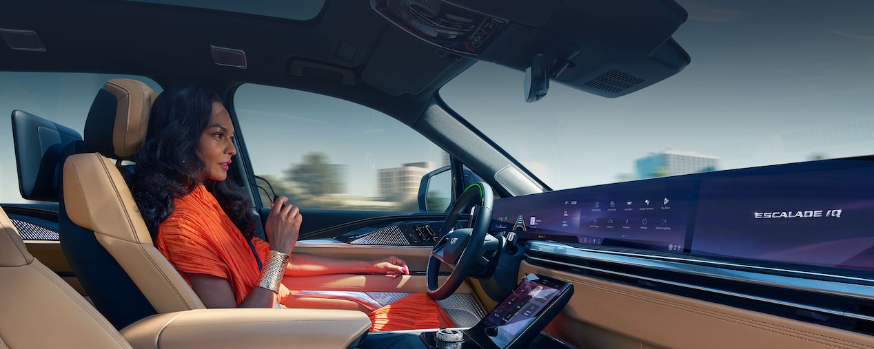 Passenger View of a Woman Driving a Cadillac with Hands Off the Steering Wheel and Utilizing the Super Cruise Feature