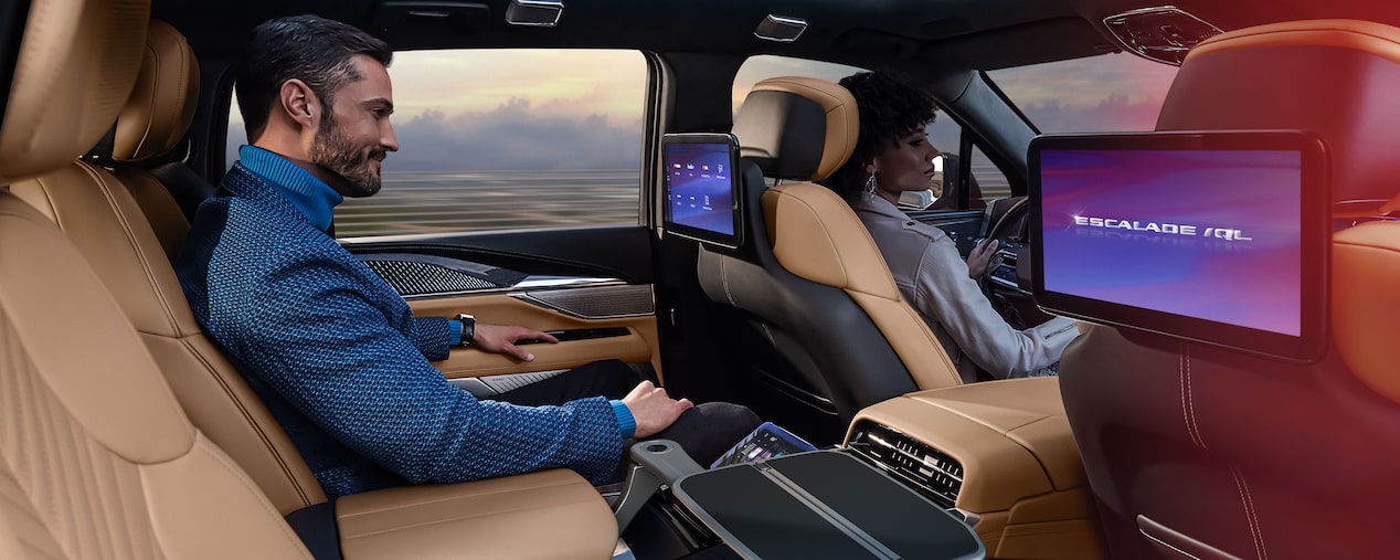 Man Smiling While Riding in the 2026 Cadillac ESCALADE IQL Executive Second Row