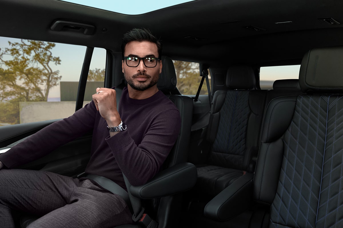 A Man in Glasses Sitting in the Second Row Captain Chair of the 2026 ESCALADE IQL Long Range EV