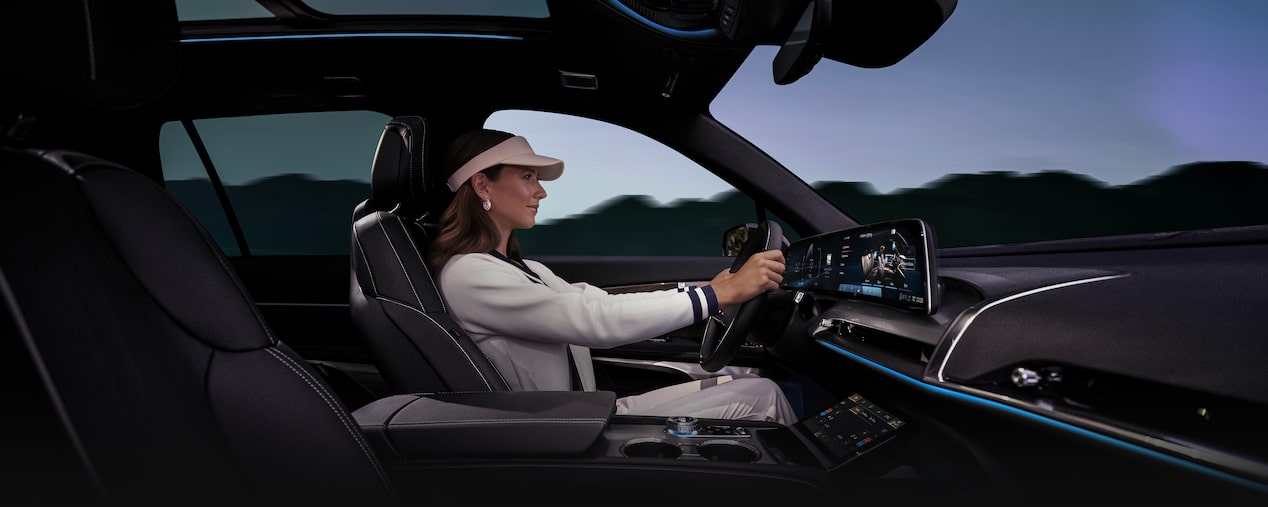 A Woman Plugs In the Charging Cord to the Charging Port on the Cadillac LYRIQ