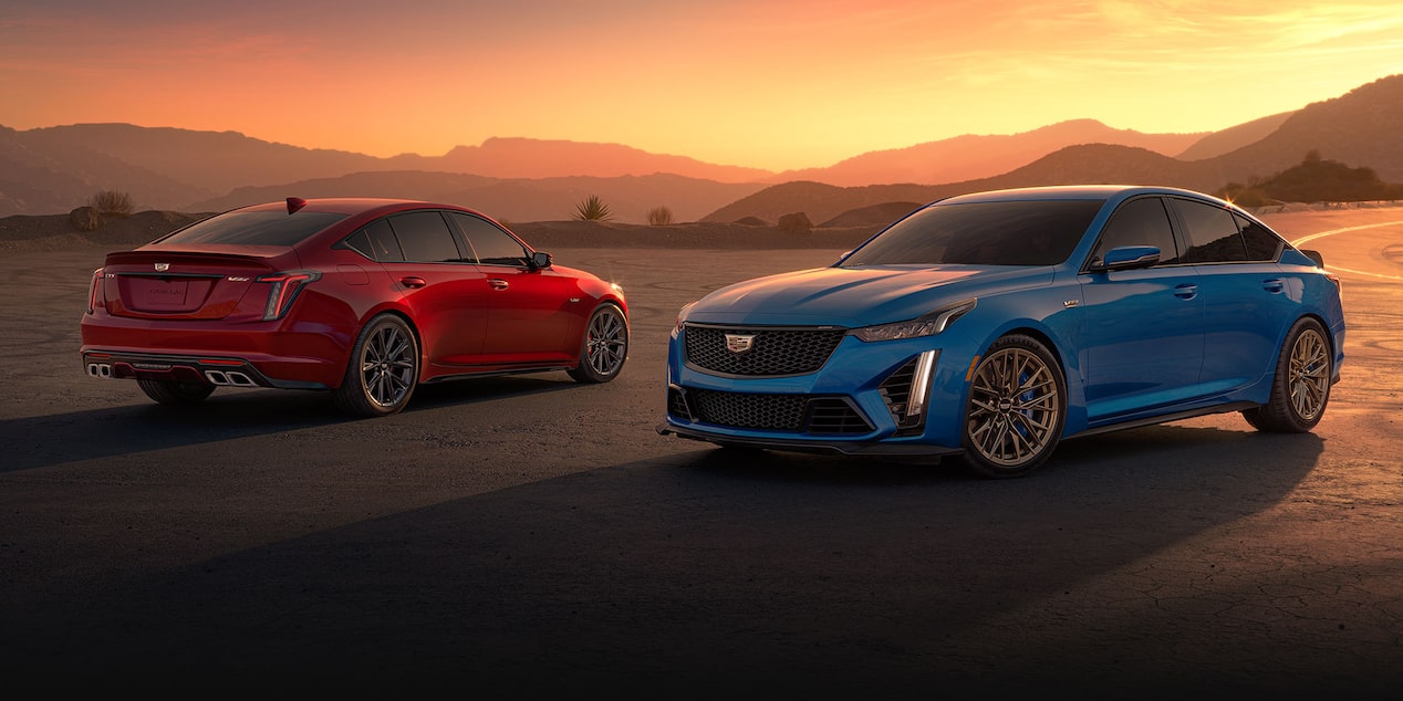 Two 2024 Cadillac CT5-V Sedans Parked in the Desert Under an Evening Sky