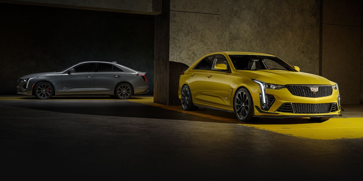 Two 2025 Cadillac CT4-V Sedans Parked in a Parking Garage