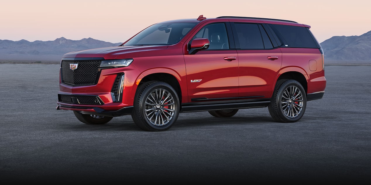 The Side Profile of a Red 2024 Cadillac Escalade-V Parked in the Desert